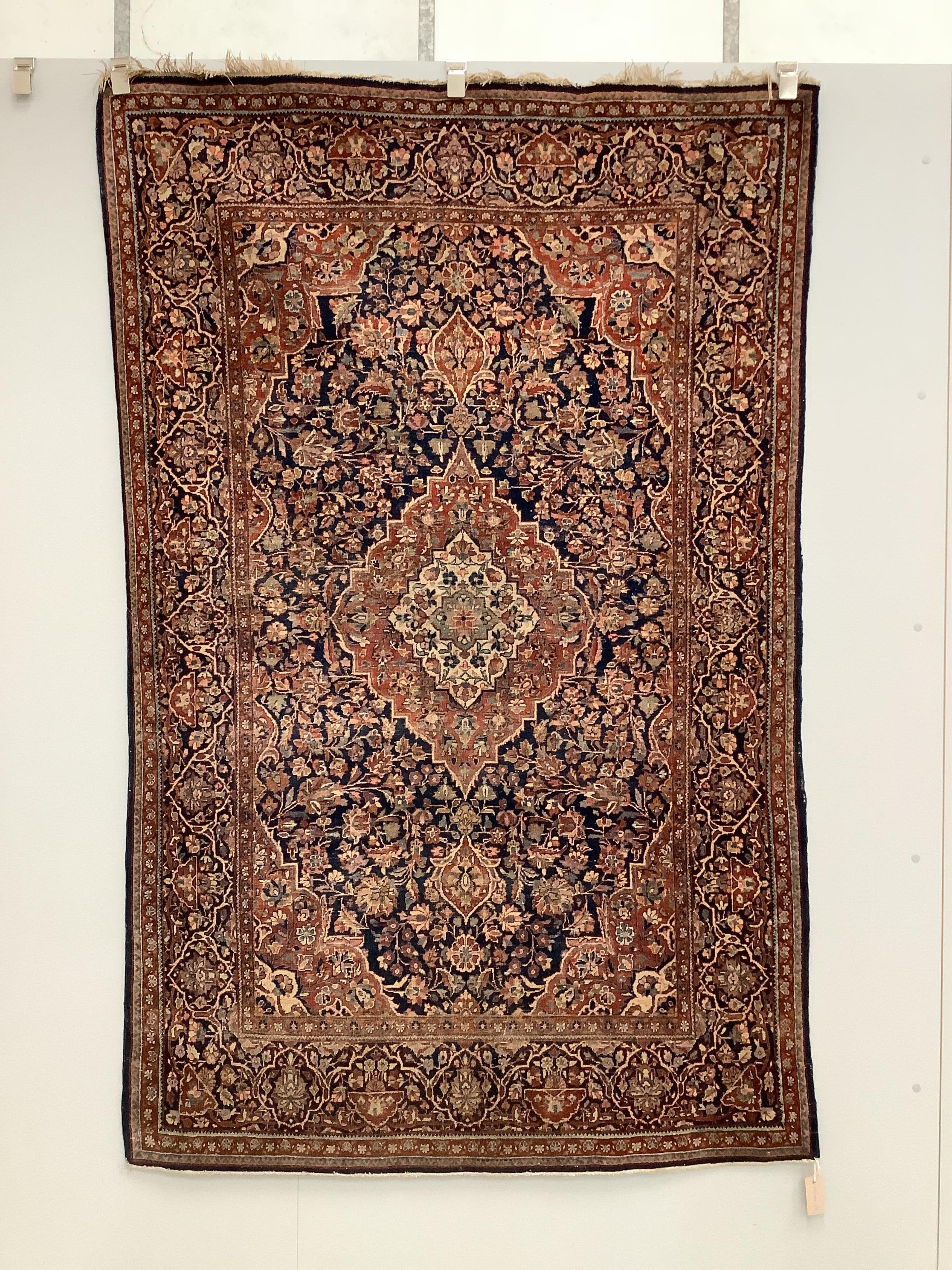 An Isphahan pink medallion rug, with a blue field, 200 x 130cm